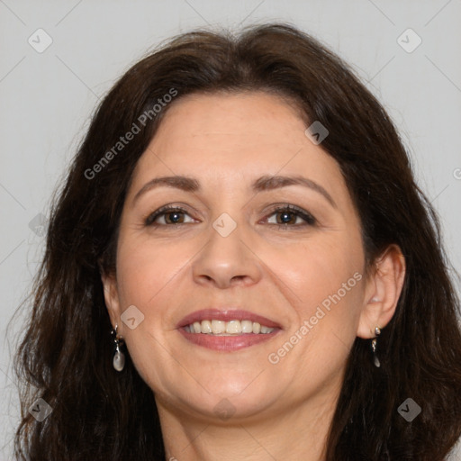 Joyful white adult female with long  brown hair and brown eyes