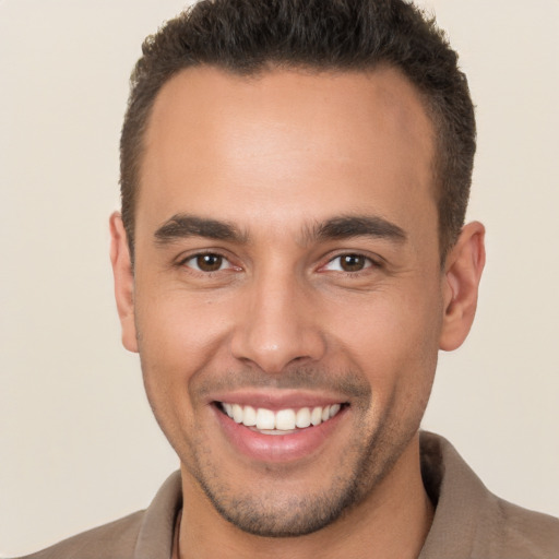 Joyful white young-adult male with short  brown hair and brown eyes