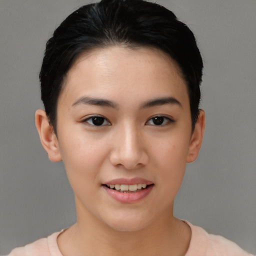 Joyful asian young-adult female with short  black hair and brown eyes