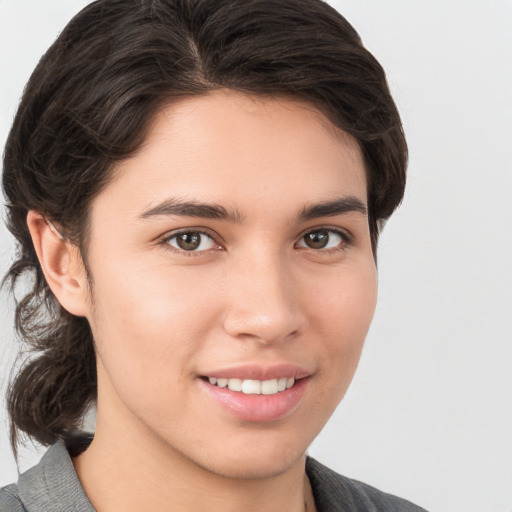 Joyful white young-adult male with medium  brown hair and brown eyes