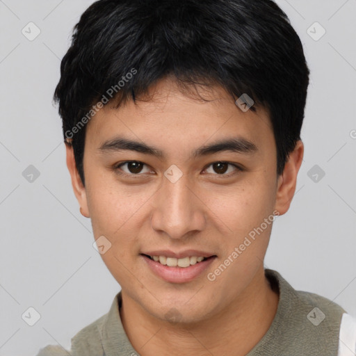 Joyful asian young-adult male with short  brown hair and brown eyes