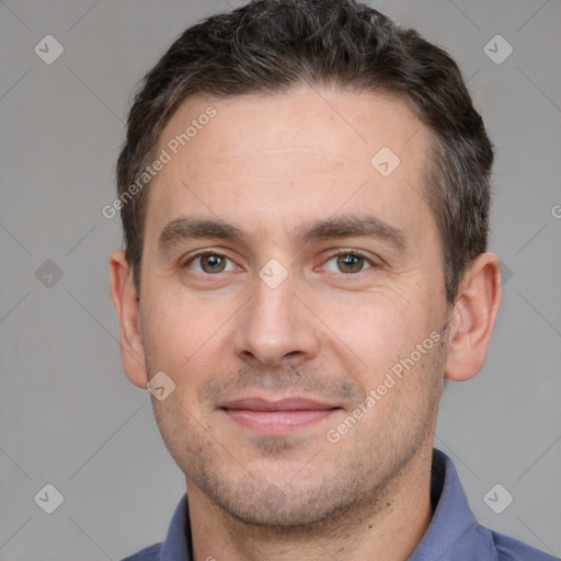 Joyful white adult male with short  brown hair and brown eyes