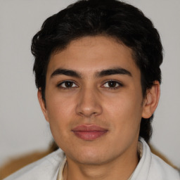 Joyful latino young-adult male with short  brown hair and brown eyes