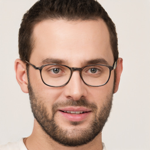 Joyful white young-adult male with short  brown hair and brown eyes