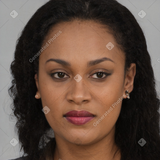 Joyful black young-adult female with long  brown hair and brown eyes