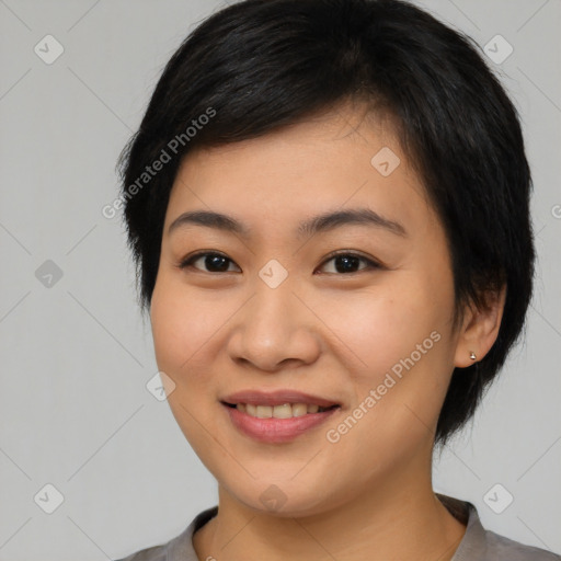 Joyful asian young-adult female with medium  black hair and brown eyes