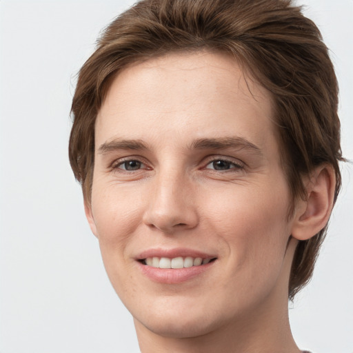 Joyful white young-adult female with short  brown hair and grey eyes