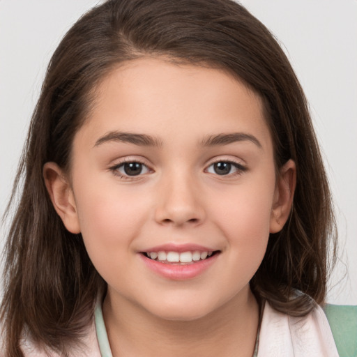 Joyful white child female with medium  brown hair and brown eyes