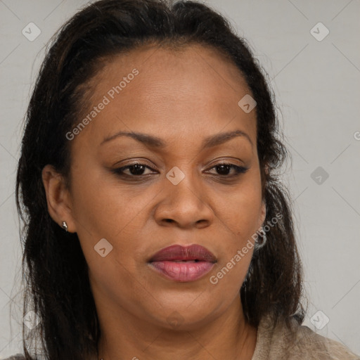 Joyful latino adult female with medium  brown hair and brown eyes