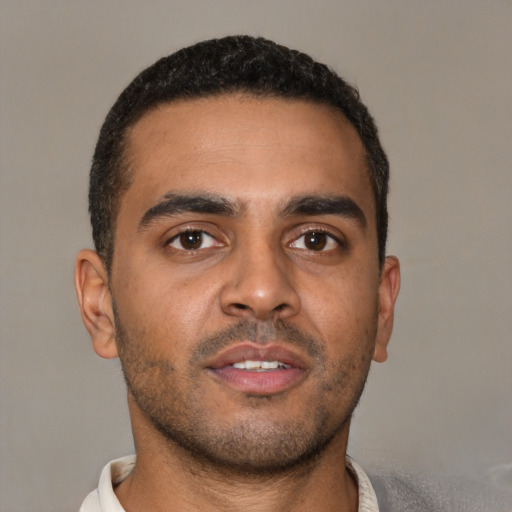 Neutral black young-adult male with short  brown hair and brown eyes
