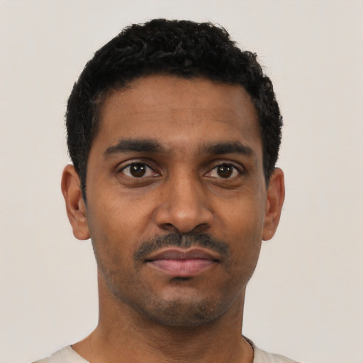 Neutral black young-adult male with short  black hair and brown eyes