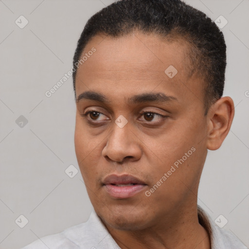 Neutral latino young-adult male with short  black hair and brown eyes