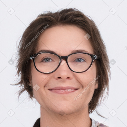 Joyful white adult female with medium  brown hair and blue eyes