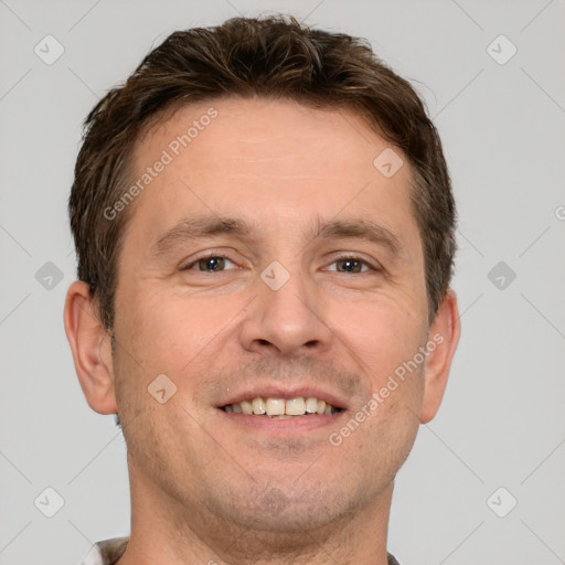 Joyful white adult male with short  brown hair and brown eyes