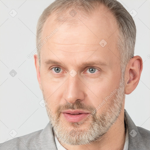 Neutral white adult male with short  brown hair and grey eyes