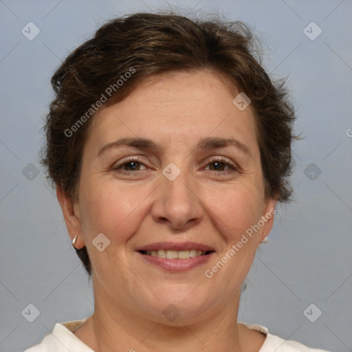 Joyful white adult female with short  brown hair and brown eyes