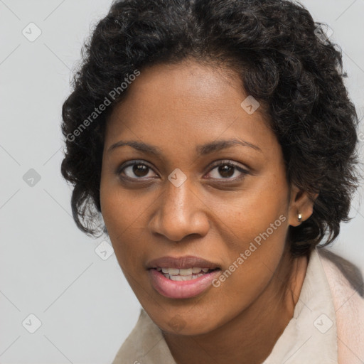 Joyful black young-adult female with long  brown hair and brown eyes