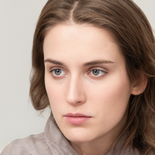 Neutral white young-adult female with long  brown hair and grey eyes