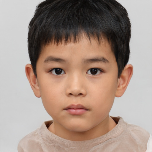 Neutral asian child male with short  brown hair and brown eyes