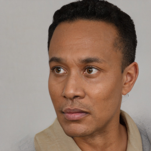 Neutral latino adult male with short  black hair and brown eyes