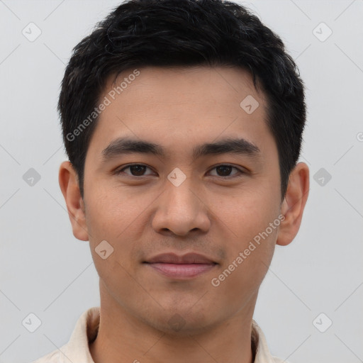 Joyful latino young-adult male with short  brown hair and brown eyes