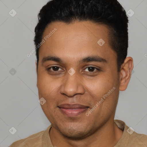 Joyful black young-adult male with short  brown hair and brown eyes