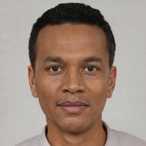 Neutral black young-adult male with short  black hair and brown eyes