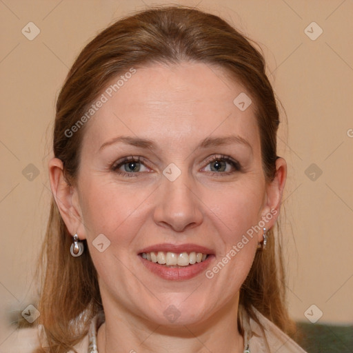 Joyful white adult female with medium  brown hair and blue eyes