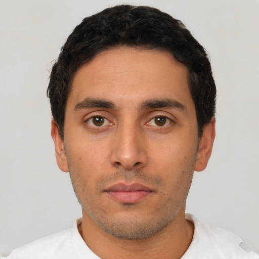 Neutral latino young-adult male with short  black hair and brown eyes