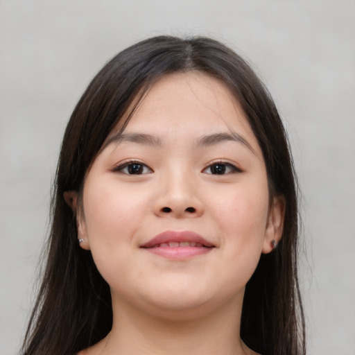 Joyful asian young-adult female with long  brown hair and brown eyes