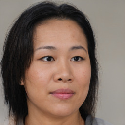 Neutral asian young-adult female with medium  brown hair and brown eyes