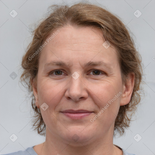 Joyful white adult female with medium  brown hair and grey eyes