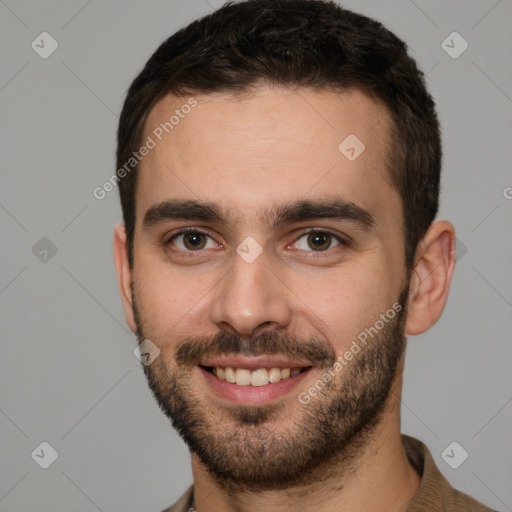 Joyful white young-adult male with short  brown hair and brown eyes