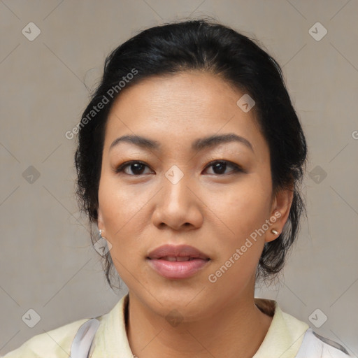 Joyful asian young-adult female with medium  black hair and brown eyes