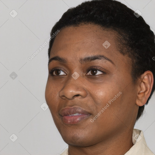 Joyful black young-adult female with short  black hair and brown eyes