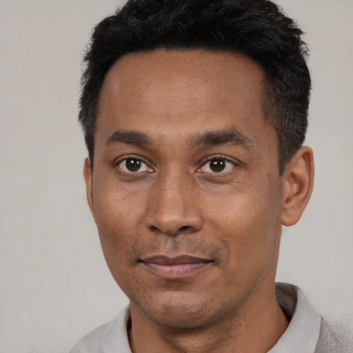 Neutral latino adult male with short  black hair and brown eyes