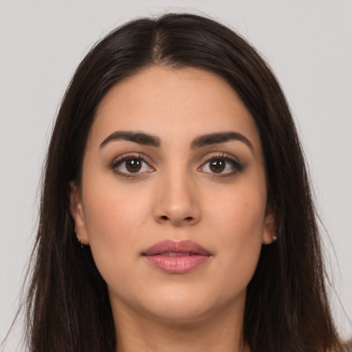 Neutral latino young-adult female with long  brown hair and brown eyes