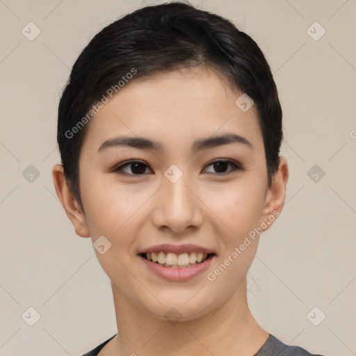 Joyful asian young-adult female with short  black hair and brown eyes