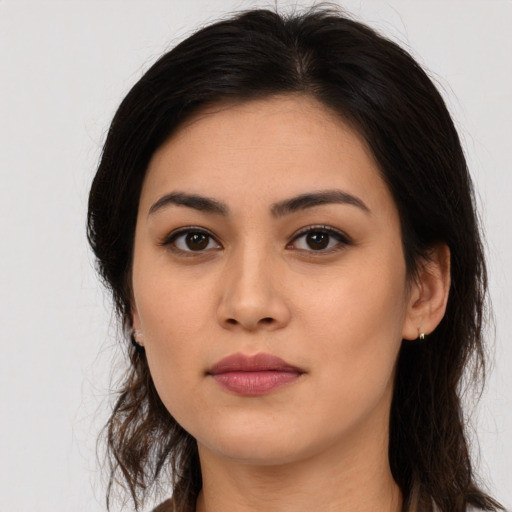 Neutral latino young-adult female with long  brown hair and brown eyes