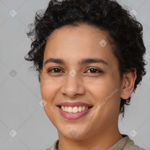 Joyful latino young-adult female with short  brown hair and brown eyes