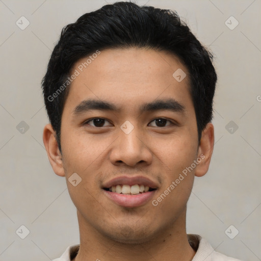 Joyful asian young-adult male with short  black hair and brown eyes