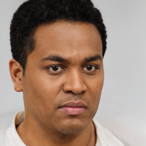 Neutral latino young-adult male with short  brown hair and brown eyes