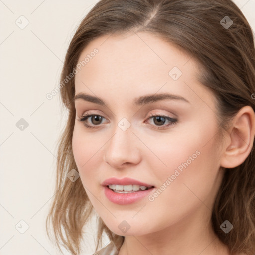 Joyful white young-adult female with long  brown hair and grey eyes