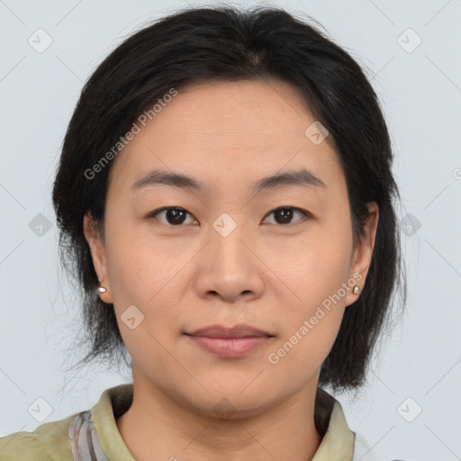 Joyful asian young-adult female with medium  brown hair and brown eyes