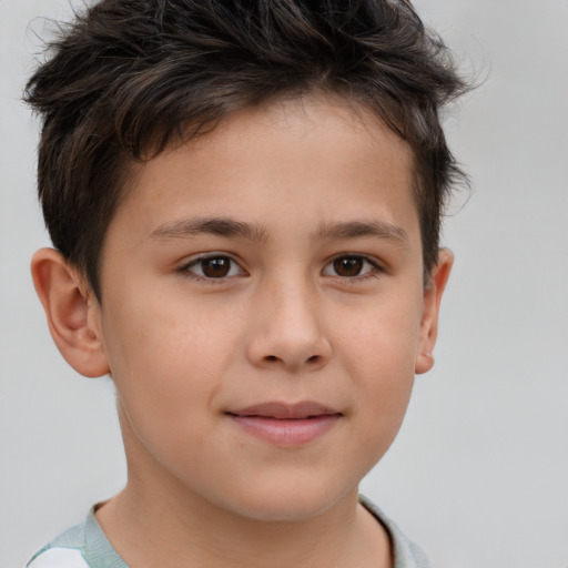 Joyful white child male with short  brown hair and brown eyes