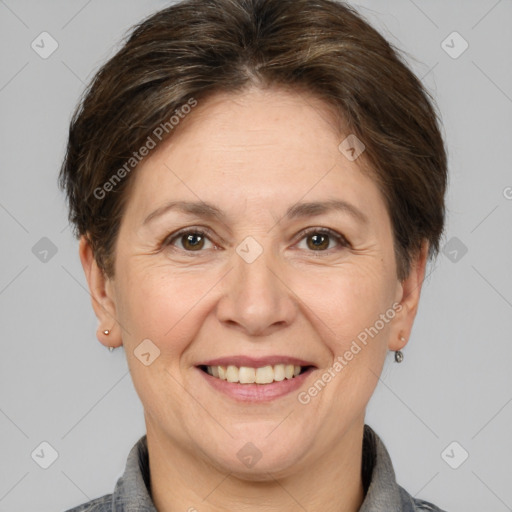 Joyful white adult female with short  brown hair and brown eyes