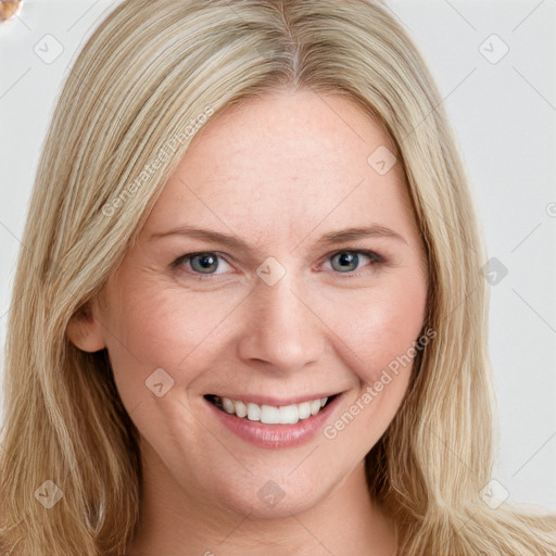 Joyful white young-adult female with long  brown hair and blue eyes