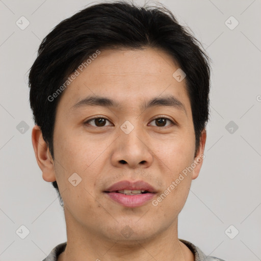 Joyful asian young-adult male with short  brown hair and brown eyes