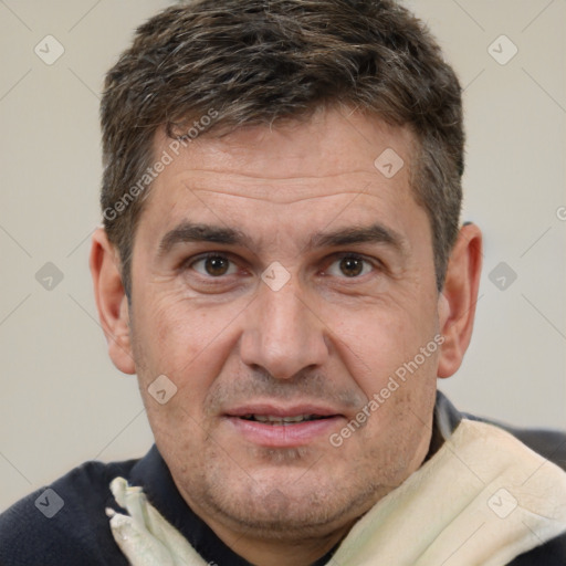 Joyful white adult male with short  brown hair and brown eyes