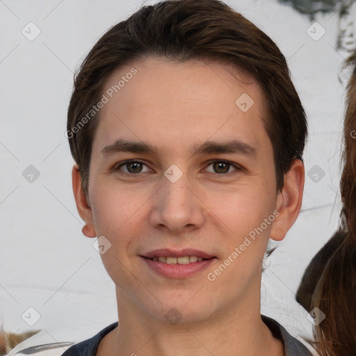 Joyful white young-adult male with short  brown hair and brown eyes